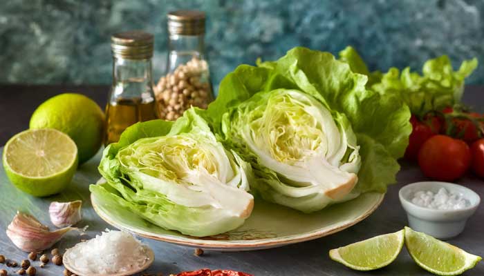 Bibb lettuce halves on plate with healthy ingredients.